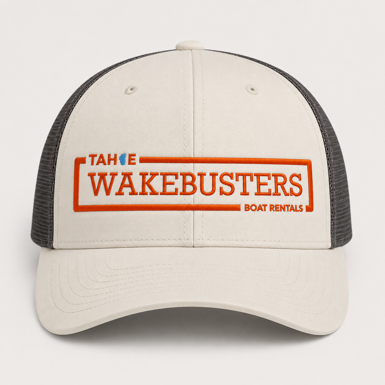 Tahoe WakeBusters Trucker Hat — Cream and Charcoal with orange embroidered logo