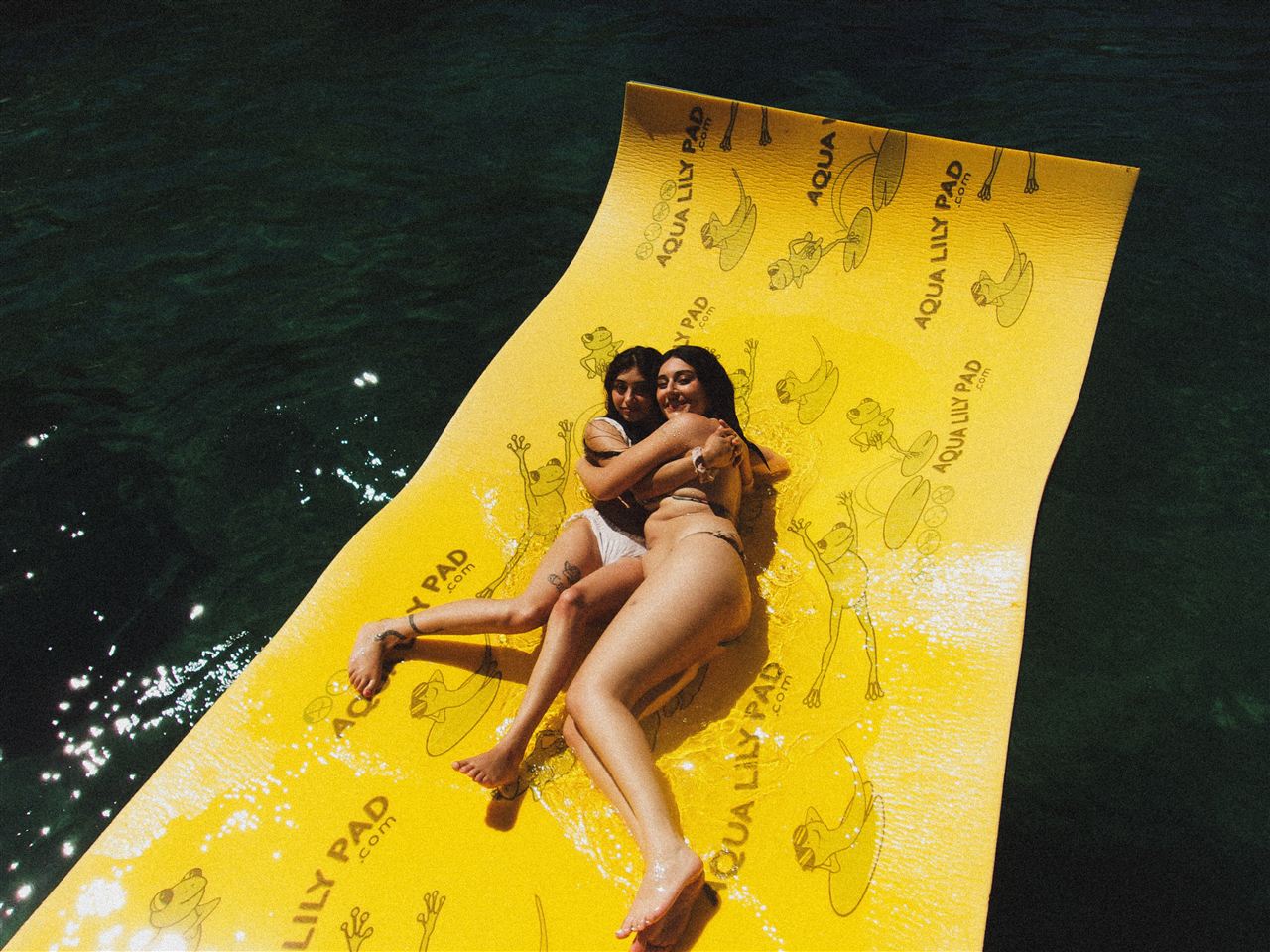 Guests relaxing on the lily pad during a Lake Tahoe boat rental