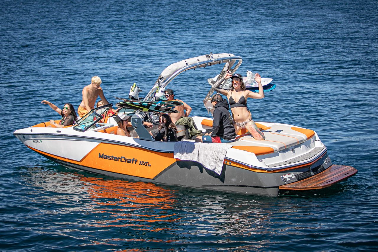 Guests relaxing on a Bennington tritoon pontoon rental on Lake Tahoe
