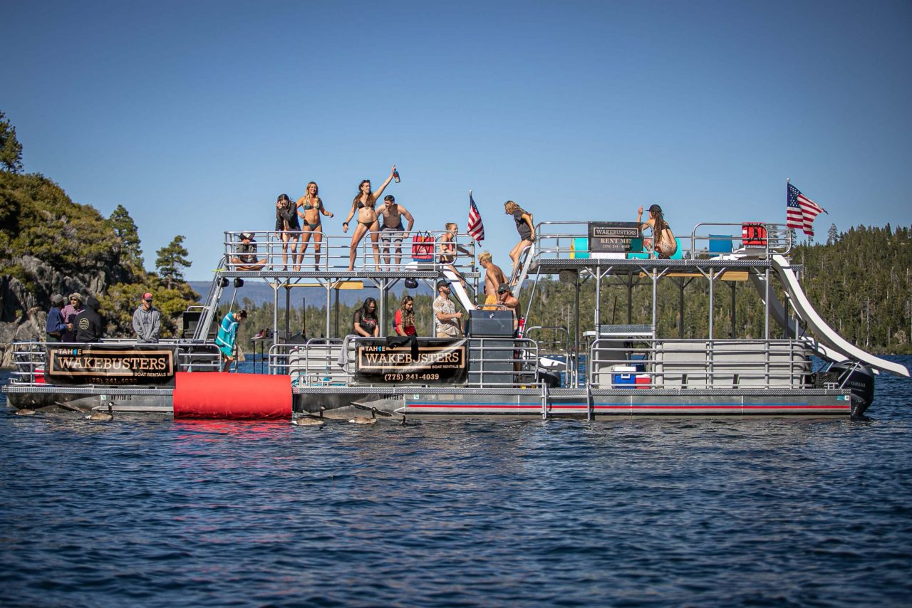 Wakesurfer riding a wave on Lake Tahoe with Tahoe WakeBusters wakesurf charter