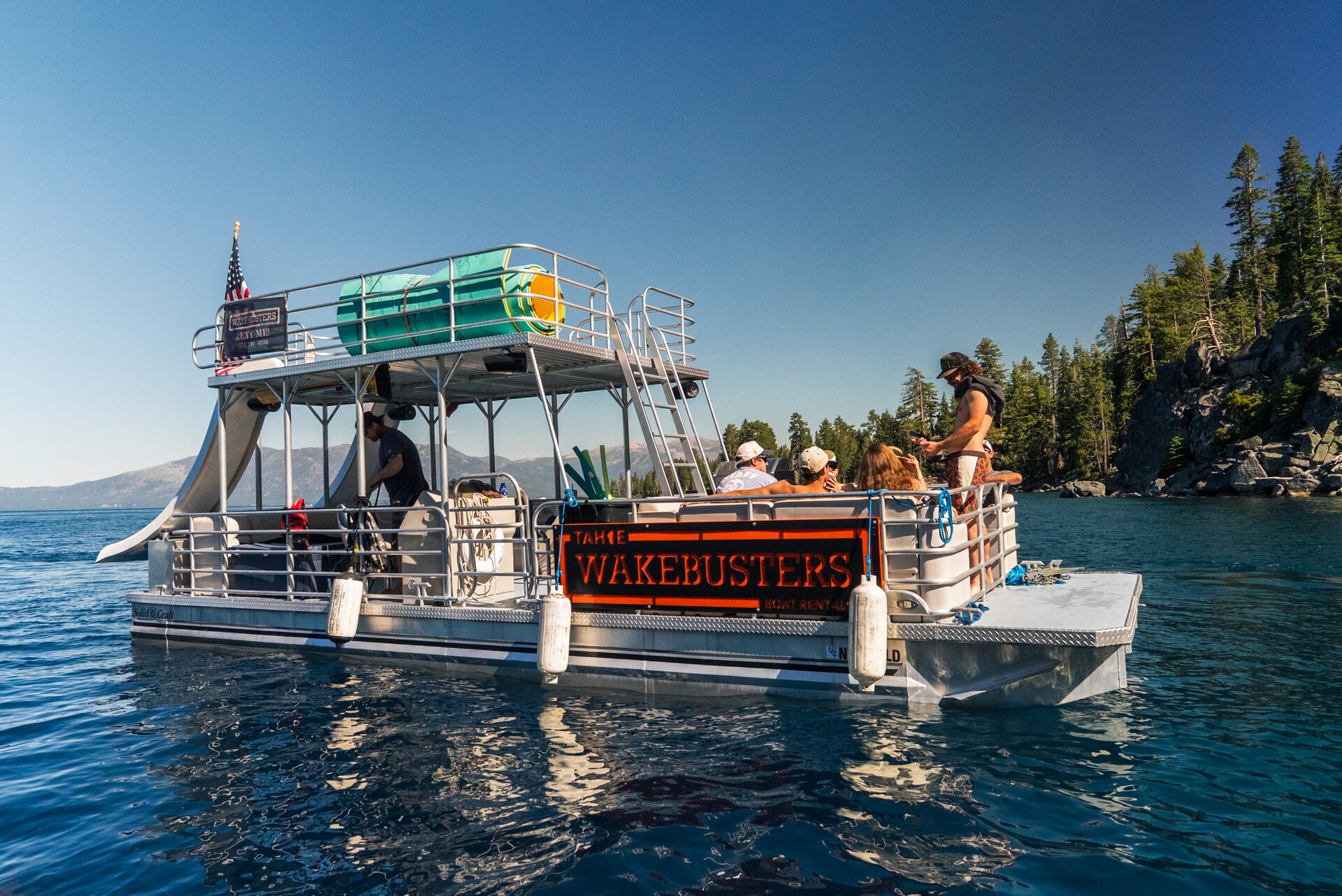 Wakesurfer riding a wave on Lake Tahoe with Tahoe WakeBusters wakesurf charter